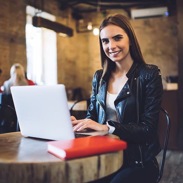 Woman on her laptop reading about Chicago Web Design
