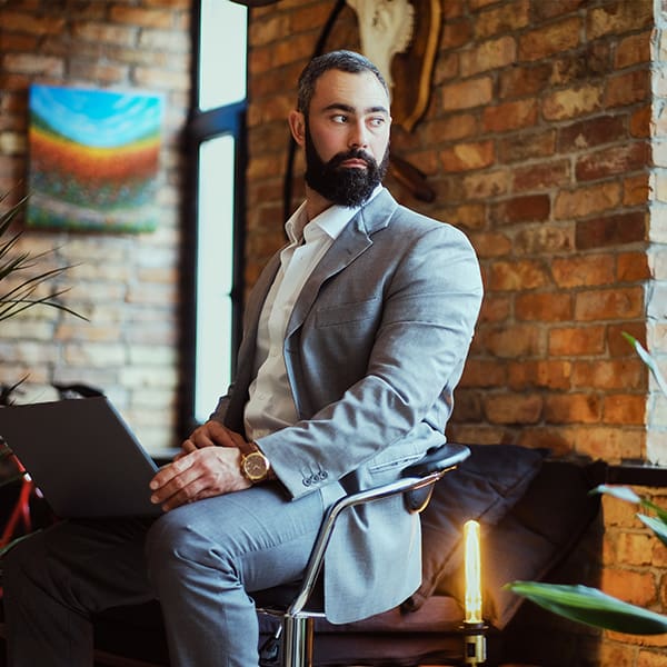 Man at his computer learning about WordPress maintenance plans