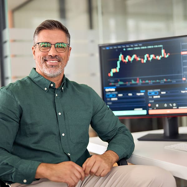 Man at his computer with DIY SEO Software